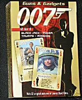Guns & Gadgets  James Bond 007 Heroes & Villians 4 in 1 Playing Cards    The are some of the finest cards you are ever likely to own. Not only are they fantastic quality and value, they also come in a neat collectable tin. One of the two decks feature the 'Heroes and Villains' of the bond films including Jaws, Blofeld, the Bond girls and Bond himself. The other deck features the 'Guns and Gadgets' including many of Qs gadgets along with those used by the villains. Each of the cards give values for different attributes such as damage, strength etc (you know how it works) for use in the trumps game. Also included are a secret viewfinder to read hidden text on the back of the cards and a booklet of instructions for various games. The gilt edging of the cards gives them a real quality and expensive feel. The tin features the bond logo on the lid in a raised up outline and a felt inner case to hold the cards in place. Complete with a neat certificate of authenticity showing the limited edition number out of 5000 this item is well worth the money even if it was