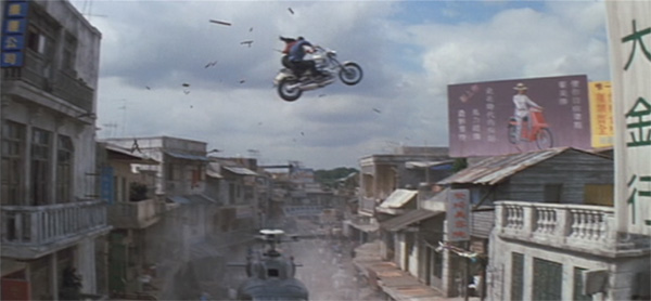 Bond and Wai Lin riding the motorcycle at high speeds through the streets of Saigon, through buildings, even up onto the roofs of the buildings